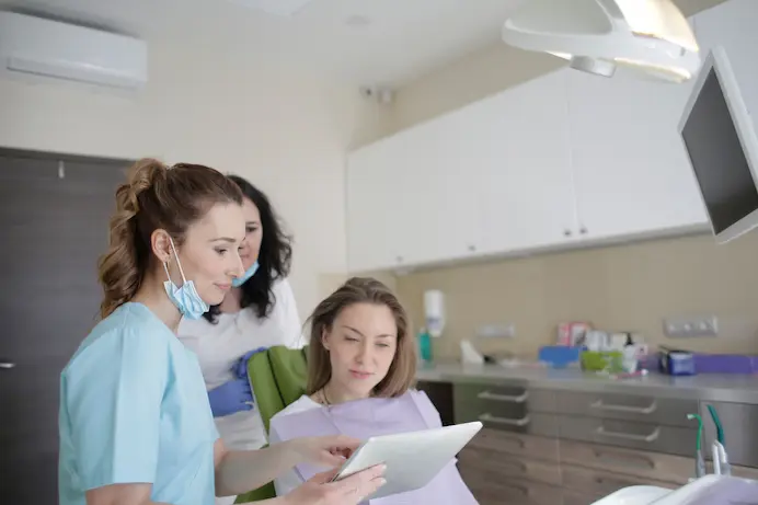 Emergency dentist team examining a patient in Louisville KY