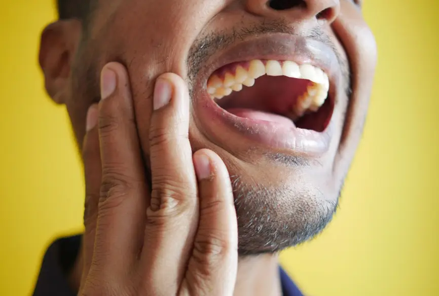 Patient experiencing tooth pain before seeing an emergency dentist in Springhurst, KY